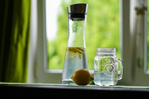 Refreshing detox water with lemon, cucumber, and mint in a glass jar, perfect boosting metabolism