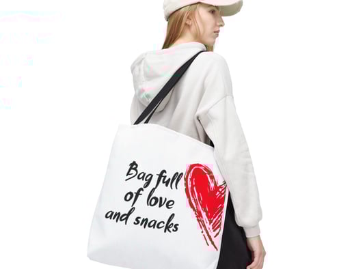 a woman in a white shirt and black pants with a red heart baguet bag