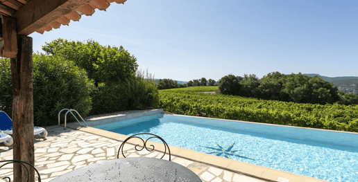 a pool with a table and chairs