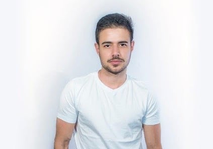 a man in a white shirt and jeans