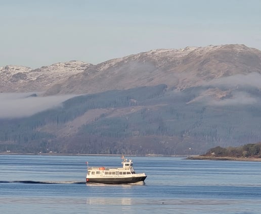 Image taken from Gourock Seaview Holiday Let of CalMac Ferry with mountains in the background