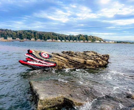 Crocodile Rock - painted rock in the water in Milport