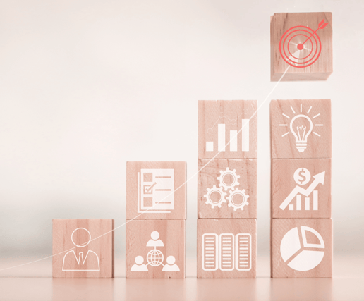 a wooden block with a building made of wood blocks showing continuous business improvements