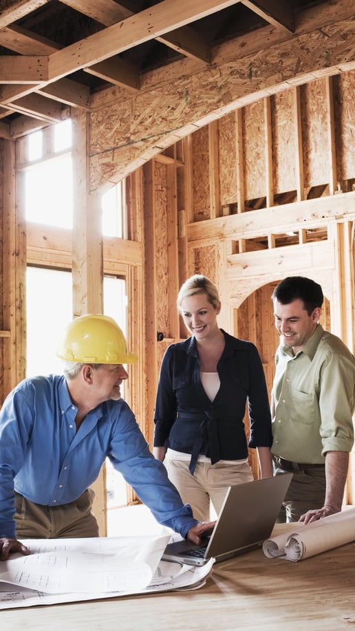 Contractor and homeowners planning home renovation project in London, Ontario.
