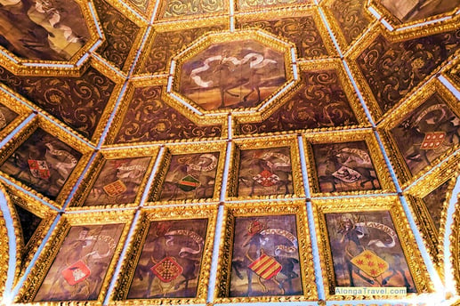 enormous carved ceiling decorated by coats of arms of noble Portuguese in Heraldic Sala dos Brasões