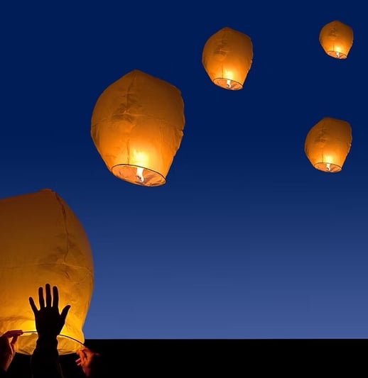 Lamps floating in the sky.