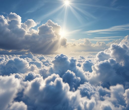 Vista áerea con desarrollo de nubes blancas por debajo y cielo azul por encima con el Sol radiante