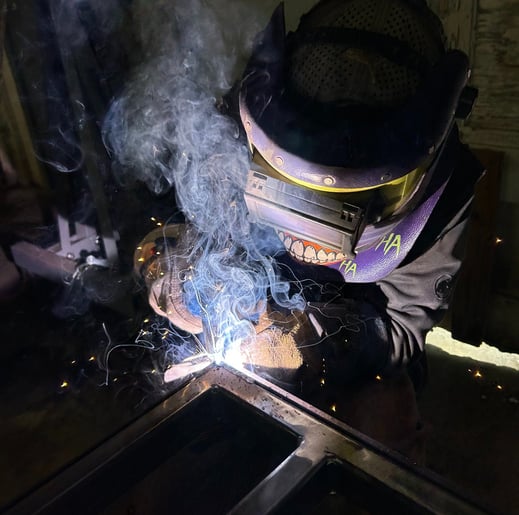 jaspar schirmer welding a steel beam