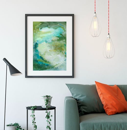 a wonderful green painting called "another earth" above a couch