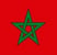 Le drapeau du Maroc, avec un fond rouge et une étoile verte à cinq branches au centre.