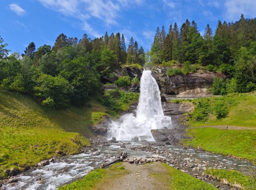 Steindalsfossen waterfall surrounded by greenery in Norway