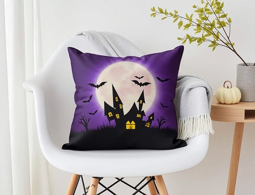 a halloween themed pillow cover with a purple and black background