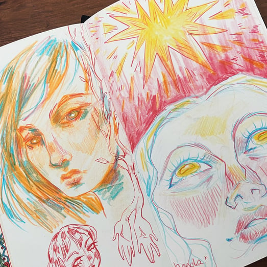 sketchbook page of portraits made with colored pencil and pen