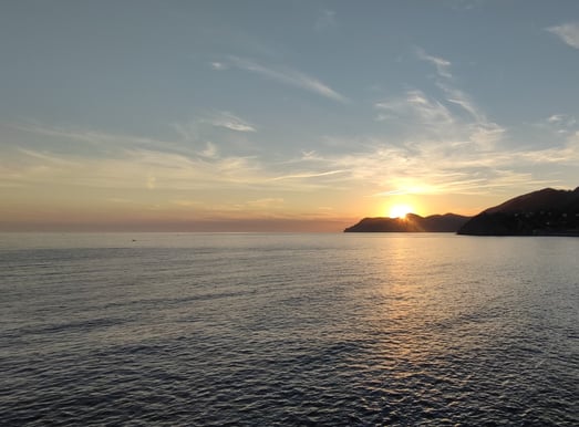 Sunset over mountain and water
