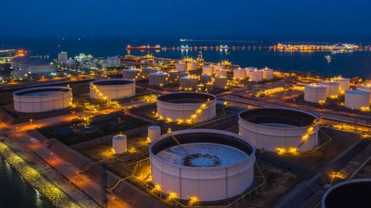 a large tank of oil tanks with lights on