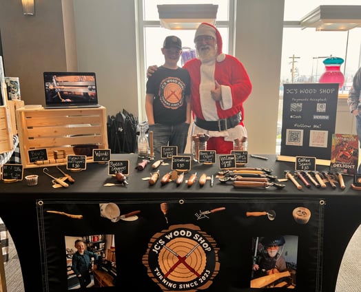 Jackson with Santa Claus at a Christmas craft fair