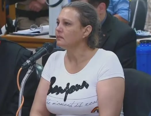 a woman in a white shirt and a man in a suit and tie