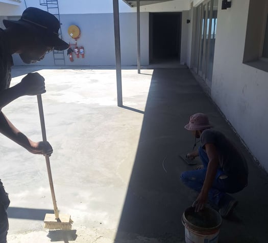 Floating surface area of specialized waterproofing screed application, Harbor Bay Mall, Simon"s Town, Cape Town