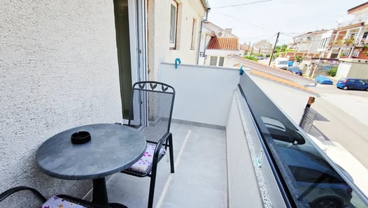 balcony with table and chairs