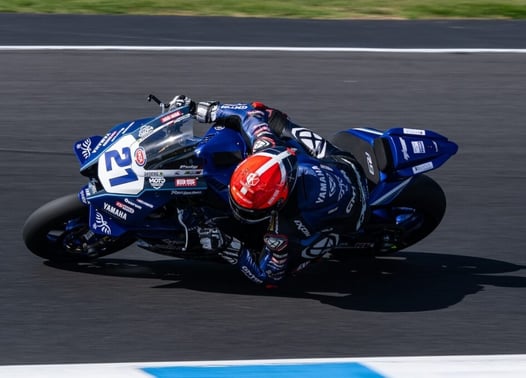 a person riding a motorcycle on a track