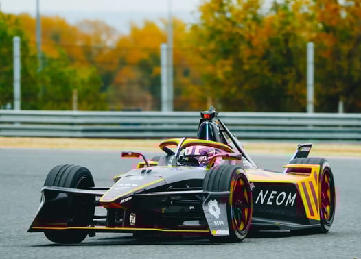 a driver racing a formua E car
