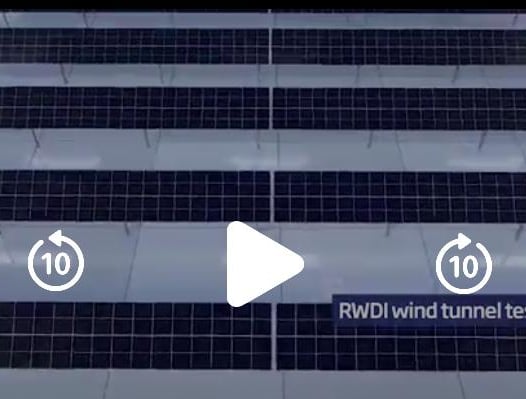 a video of a building with a number of different types of solar panels