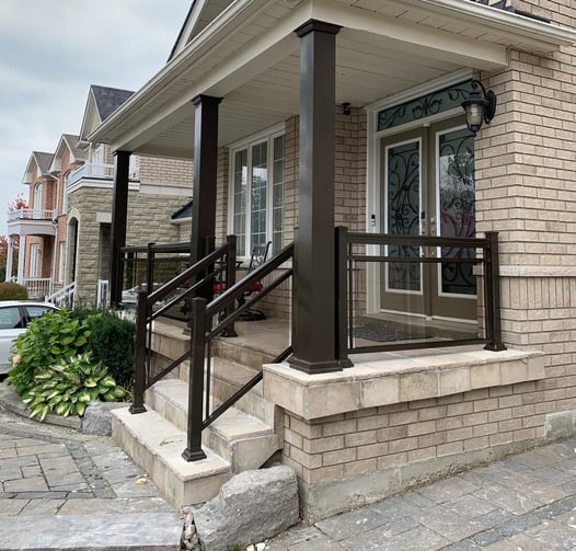 front porch with brown collumns improve the look of the house