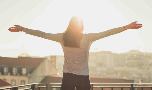 a woman with her arms outstretched out and arms outstretched out, with her arms outstretched
