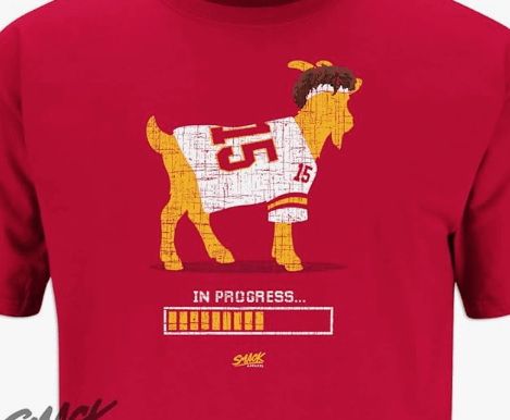 a goat in a red shirt with a goat in the middle of it