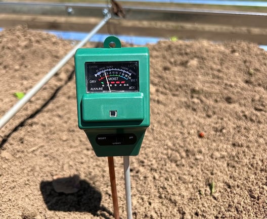 soil tester in dirt