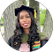 a woman in a graduation cap and gown