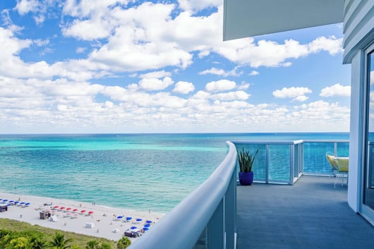 a balcony with a view of the ocean Andaz Miami Hotel