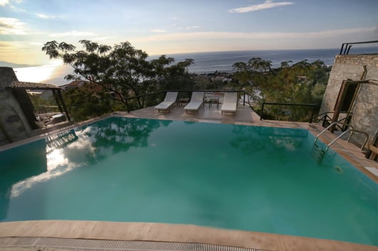 a pool with a view of the ocean Pyrgos Traditional Village