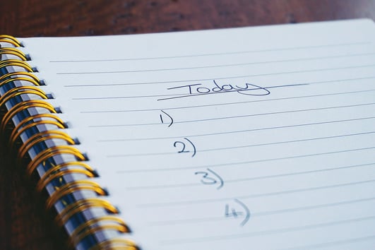 a notepad with a note pad and a pen on it