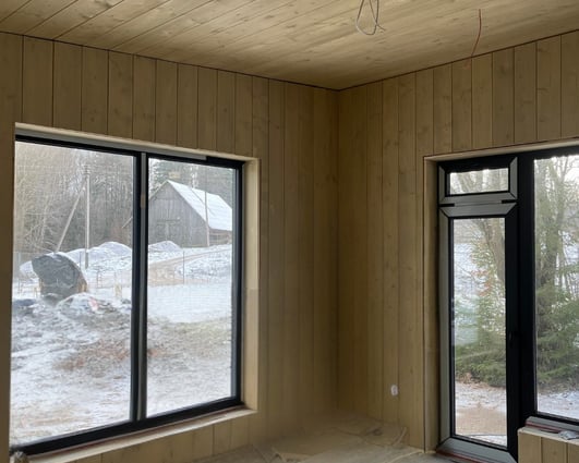 Wooden decor in a house with windows.