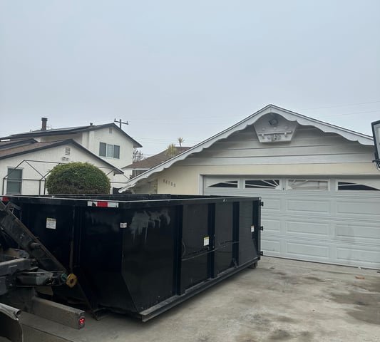 Our 18 cubic yard dumpster can be place on the driveway.