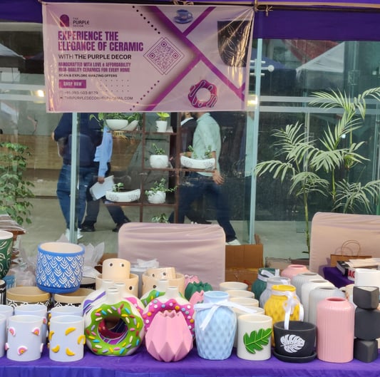 a table with a variety of ceramic products on it.