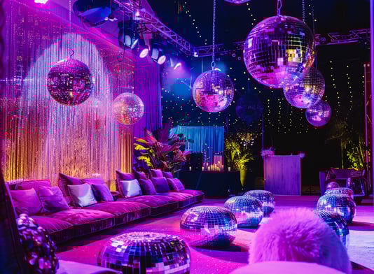 a room with a couch and disco ball decorations