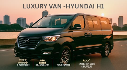Hyundai H1 luxury van for group chauffeur service in Thailand, seating 9 passengers with 8 bags, pho