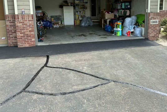 Apron repair with hot rubber crack seal