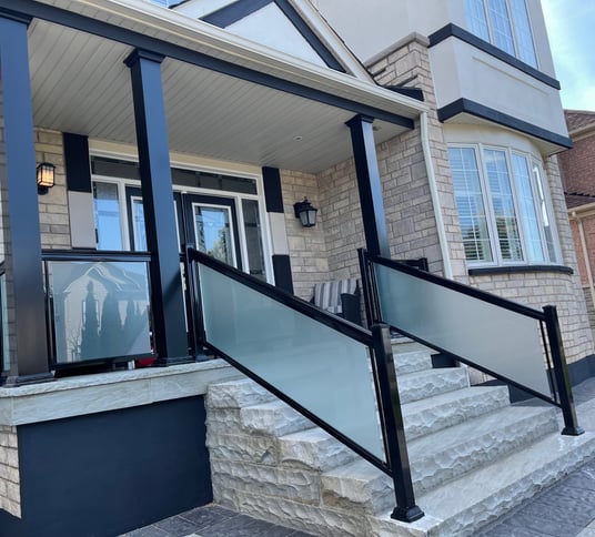 frosted glass railings with columns in driveway