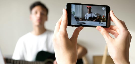 Young man creating beard care content for social media