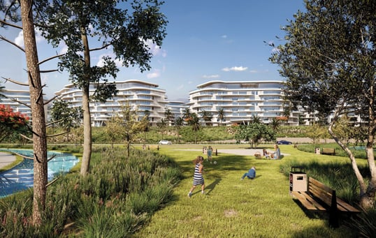  Children playing in a green park in front of One Ninety’s residential buildings.