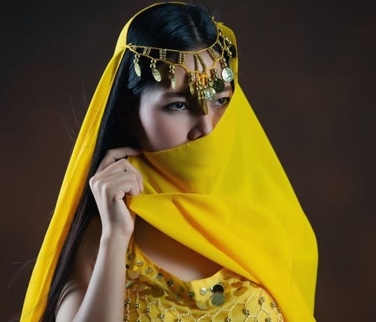a woman in a yellow veiled veiled veiled veiled veiled veil