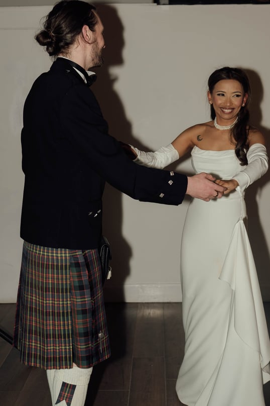 a man in a kiltrum kilt and a woman in a kilt