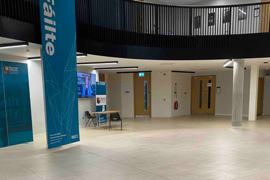 Entrance foyer - a wide level space with columns supporting a galleried upper floor
