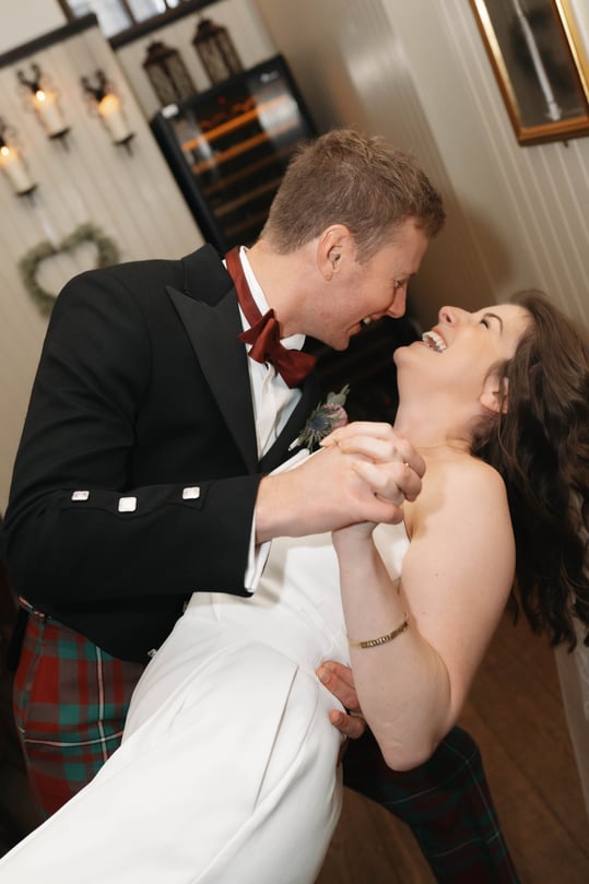 a groom and a bride are laughing naturally