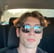 a man with sunglasses and sunglasses on his head