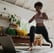 a woman doing yoga exercises on a yoga mat