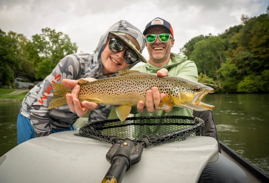 A photo of Kids fishing on the South Holston River in Tennessee.